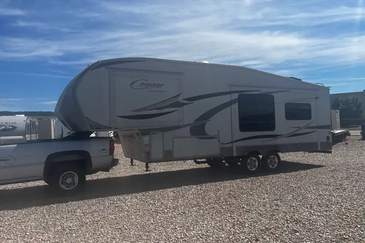 2010 Keystone Cougar 291RLS Fifth Wheel 2 slide outs on the lot at Signature Auto Sales.