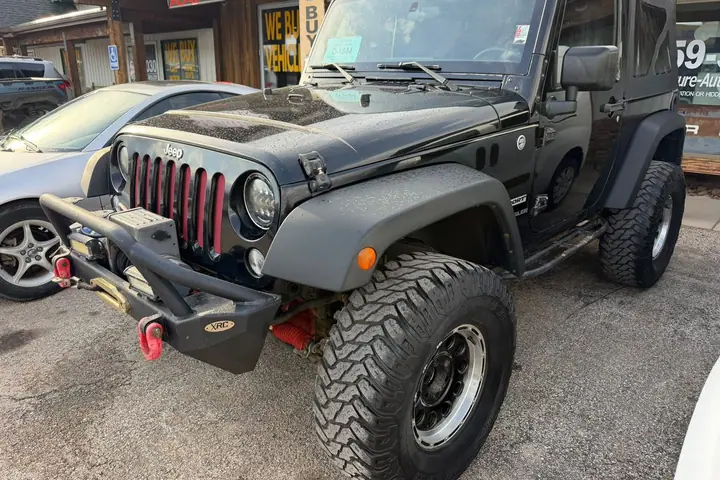 2015 4x4 Jeep Wrangler Sport on the lot at Signature Auto Sales.