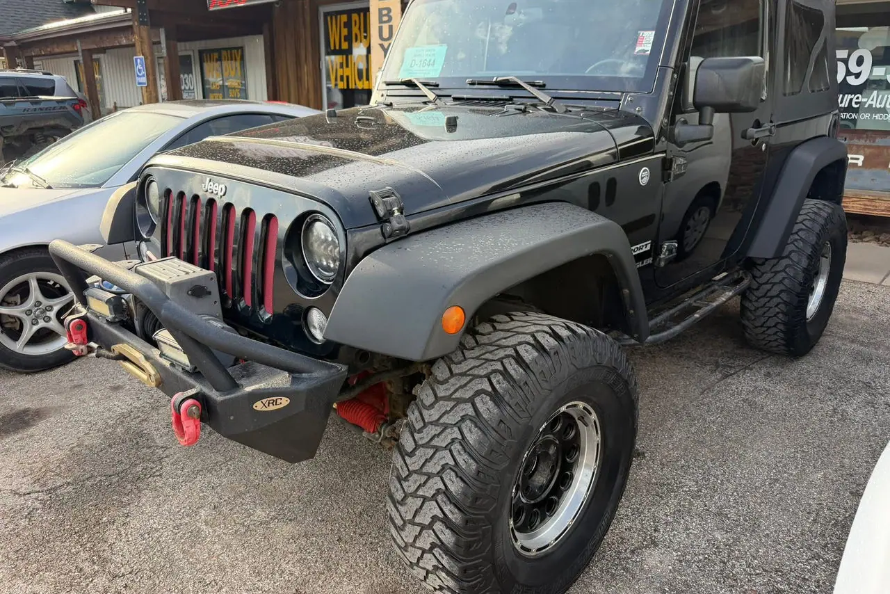2015 4x4 Jeep Wrangler Sport on the lot at Signature Auto Sales.
