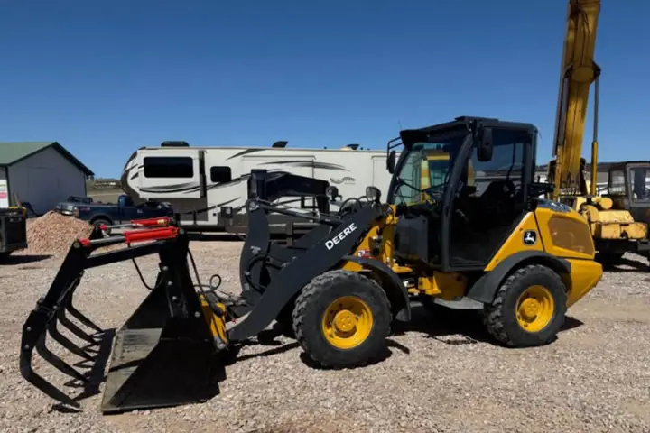 2024 John Deere 184G w/ Grapple on the lot at Signature Auto Sales.